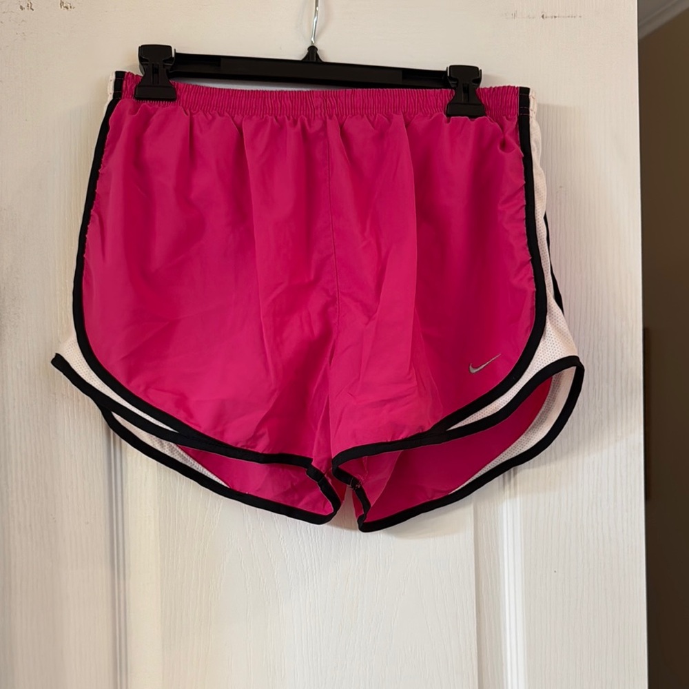 Nike Pink Athletic Shorts with Curved Hem and Elastic Waistband